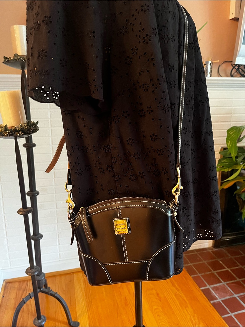 Dooney & Bourke Black Leather Crossbody Bag with Gold Zip and Cream Interior